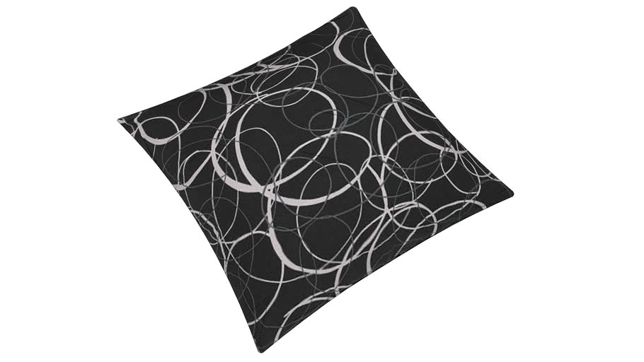 black pillow with swirls